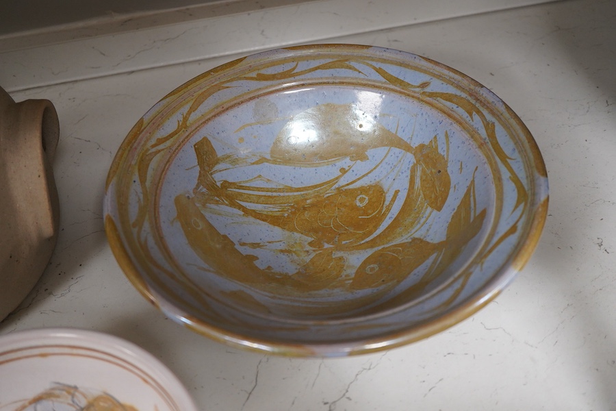 An Andrew Hill charger, 44cm diameter, two Mohammed Hamid (Lewes) bowls and two unsigned Bernard Leach pottery jars and covers